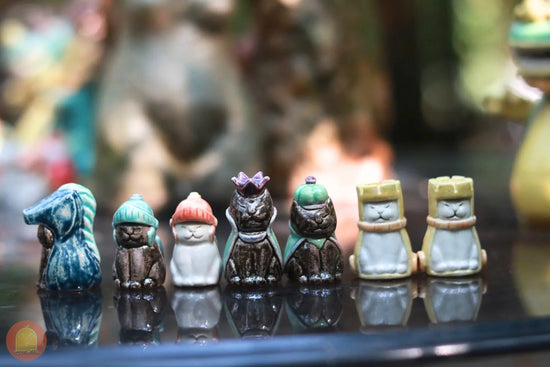 Cute clay cat figurines with colorful hats and crowns, perfect for crafting and decor